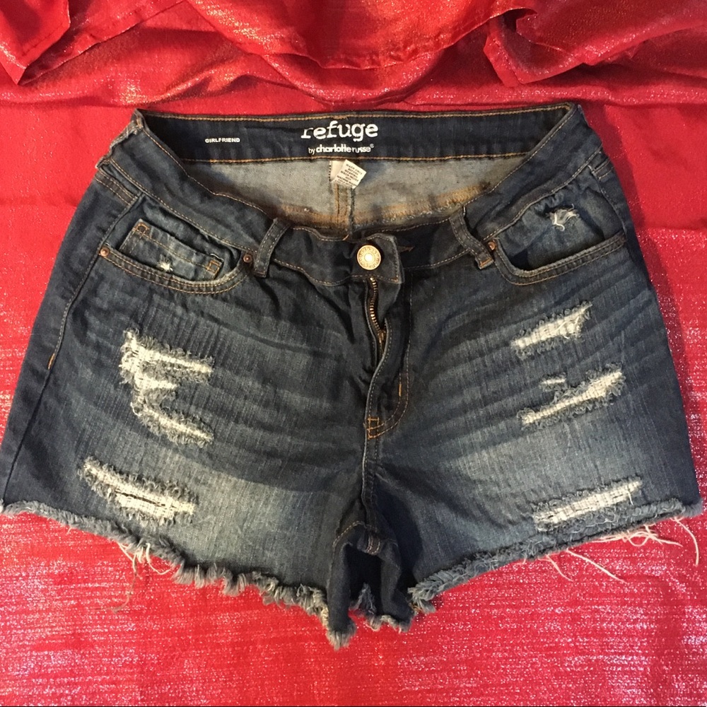 Woman’s dark denim jean shorts.